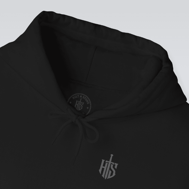Embroidered style shield emblem hoodie graphic close up
