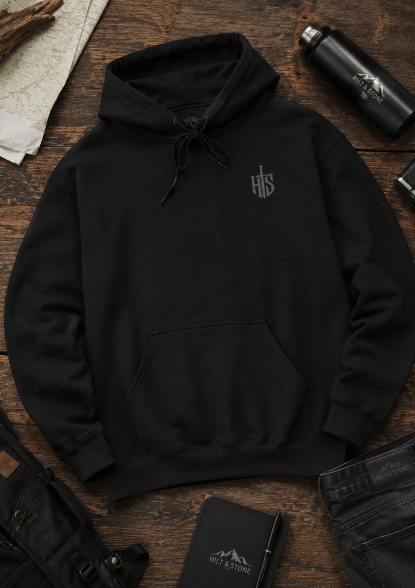 Hilt and Stone shield emblem hoodie flat lay product photo